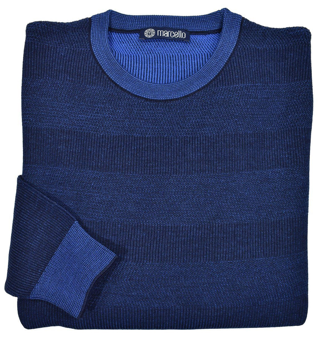 Marcello knit sweater featuring a soft, Italian merino wool blend that has a soft hand feel and a rich blue and navy color combination. The fine accent of black throughout adds dimension and sophistication. Excellent, updated traditional style works effortlessly in any setting. Classic fit, classic ribbed cuffs and waistband.  By Marcello Sport