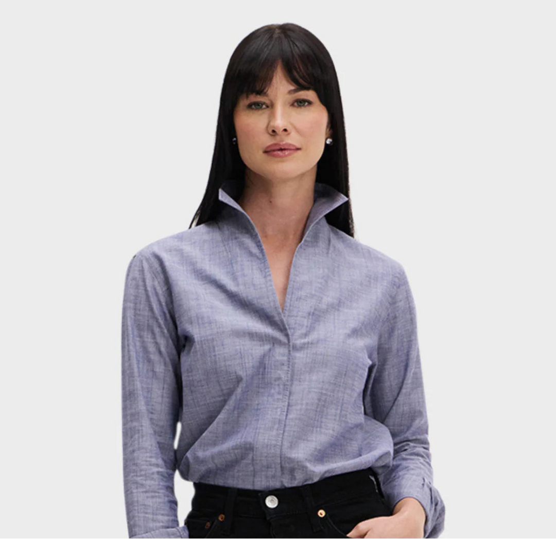 Woman wearing a light blue checkered shirt on a white background