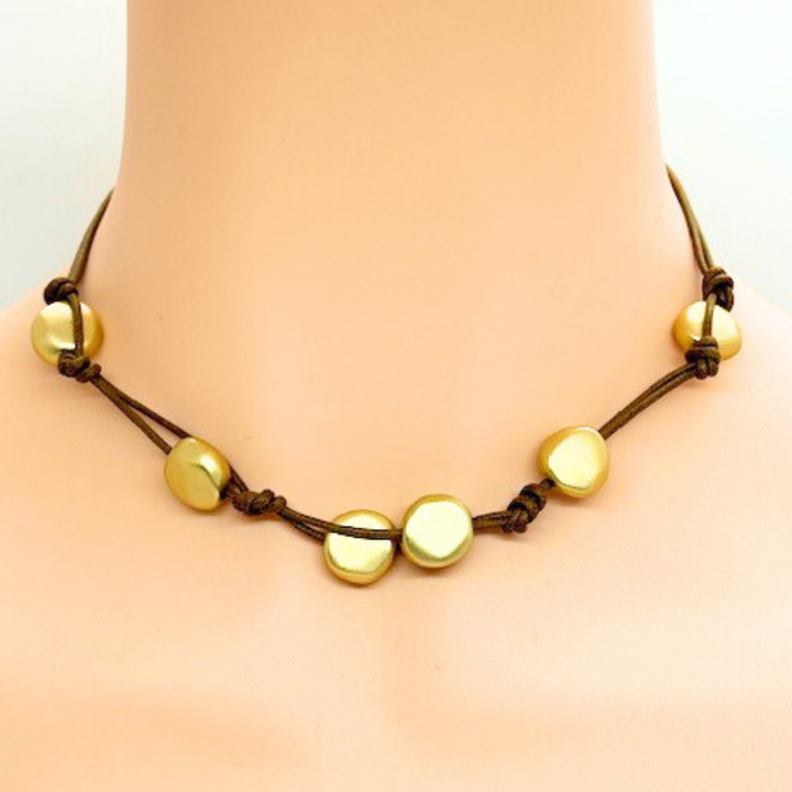 Matte Gold Bead Woven Necklace On Burgundy Linen