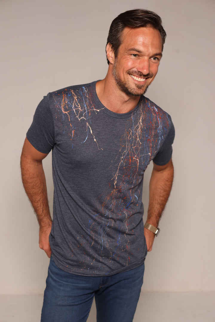 Tee shirts are not just tee shirts anymore. Our hand painted tees are individually painted by artists making each one a unique piece of art and making them stand out from other tee shirts in quality and style.  Elevate your casual fashion lifestyle with this hand painted indigo colored tee.