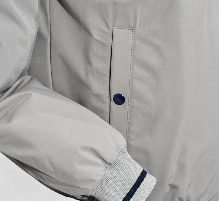 Marcello tan windbreaker reverses to navy.