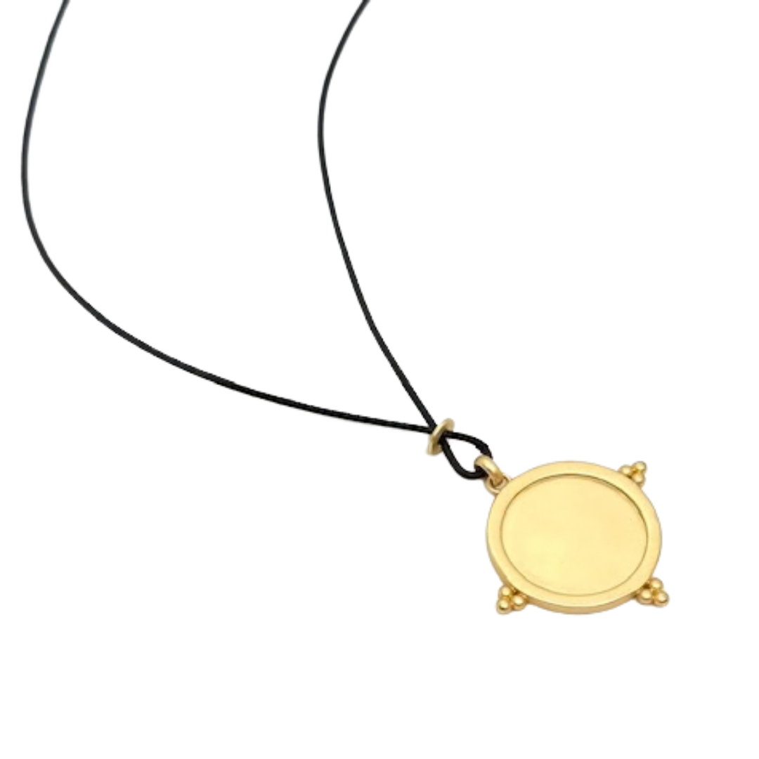 Matte Gold Starburst Pendant And Black Linen Cord Criss Cross Design Necklace