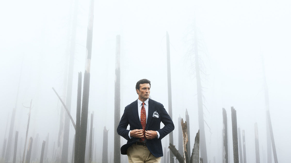 Robert Talbott Wright knit blazer in navy in a foggy forest