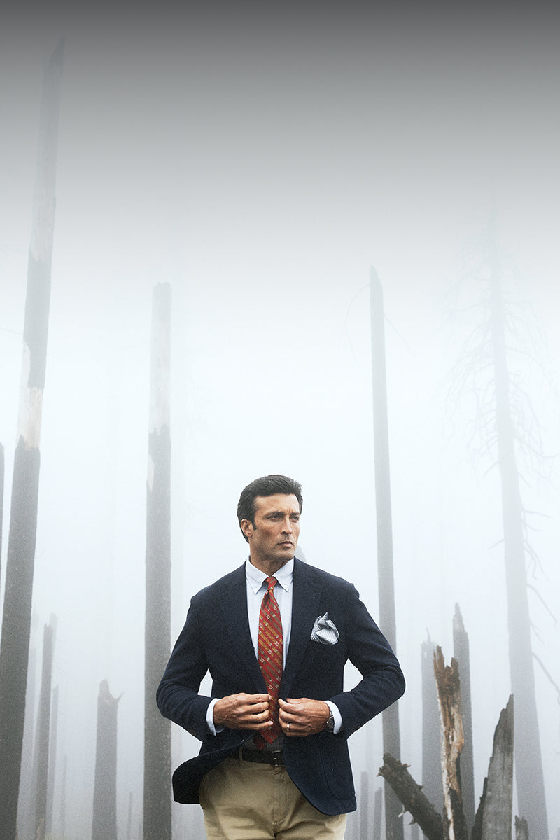 Robert Talbott Wright knit blazer in navy in a foggy forest