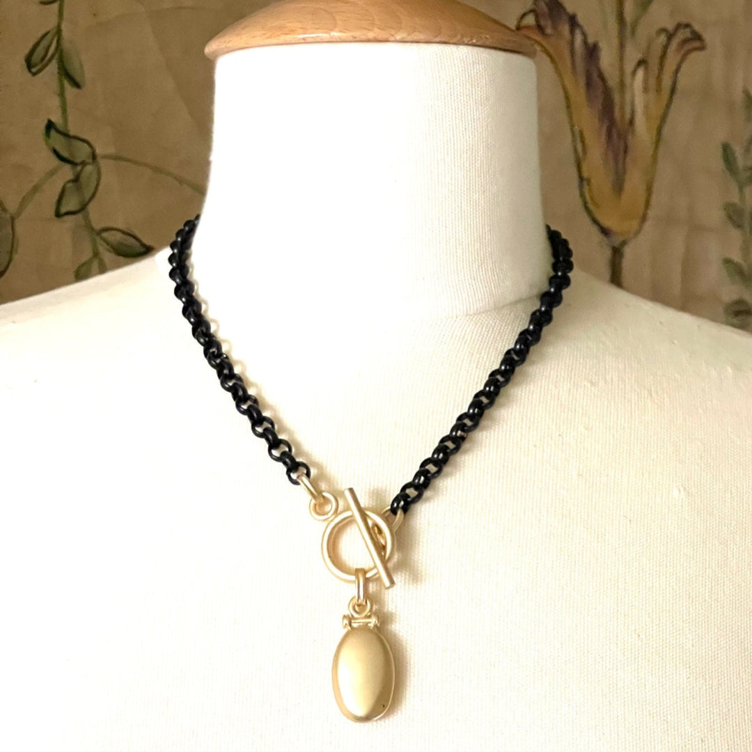 Matte Gold Pillow Pendant On Matte Black Chain